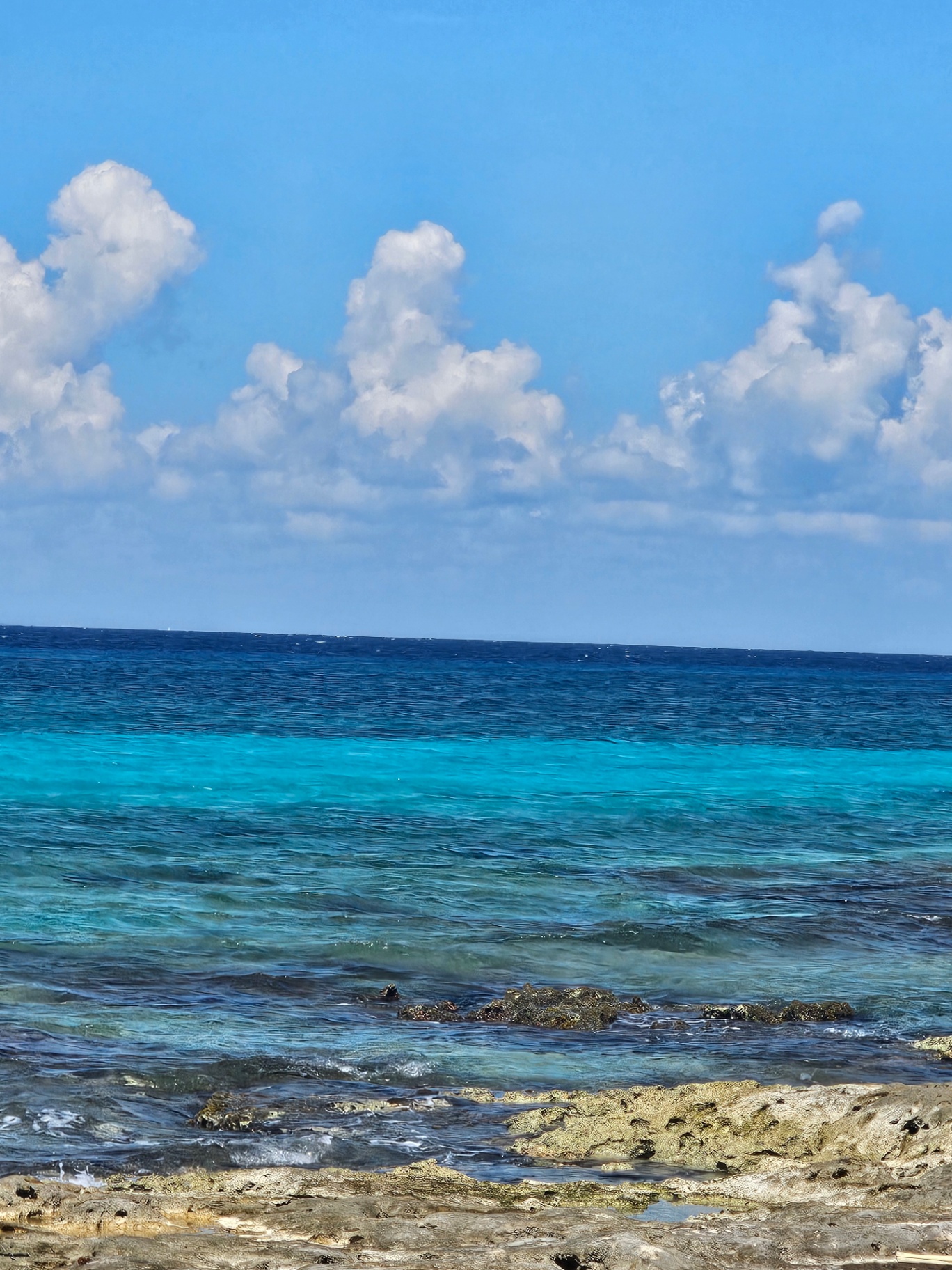 Layers of turquoise and deep blue Caribbean water