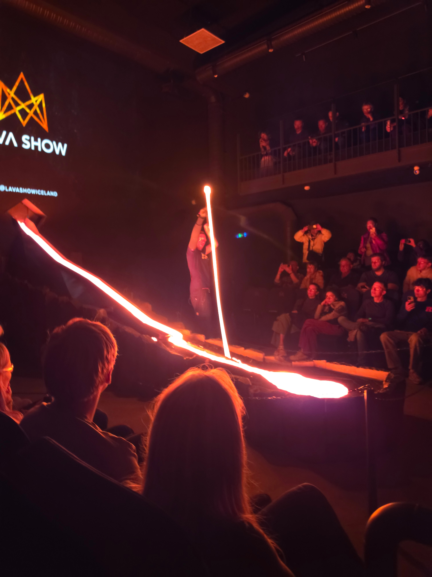 Molten lava flowing in front of an audience at the Lava Show