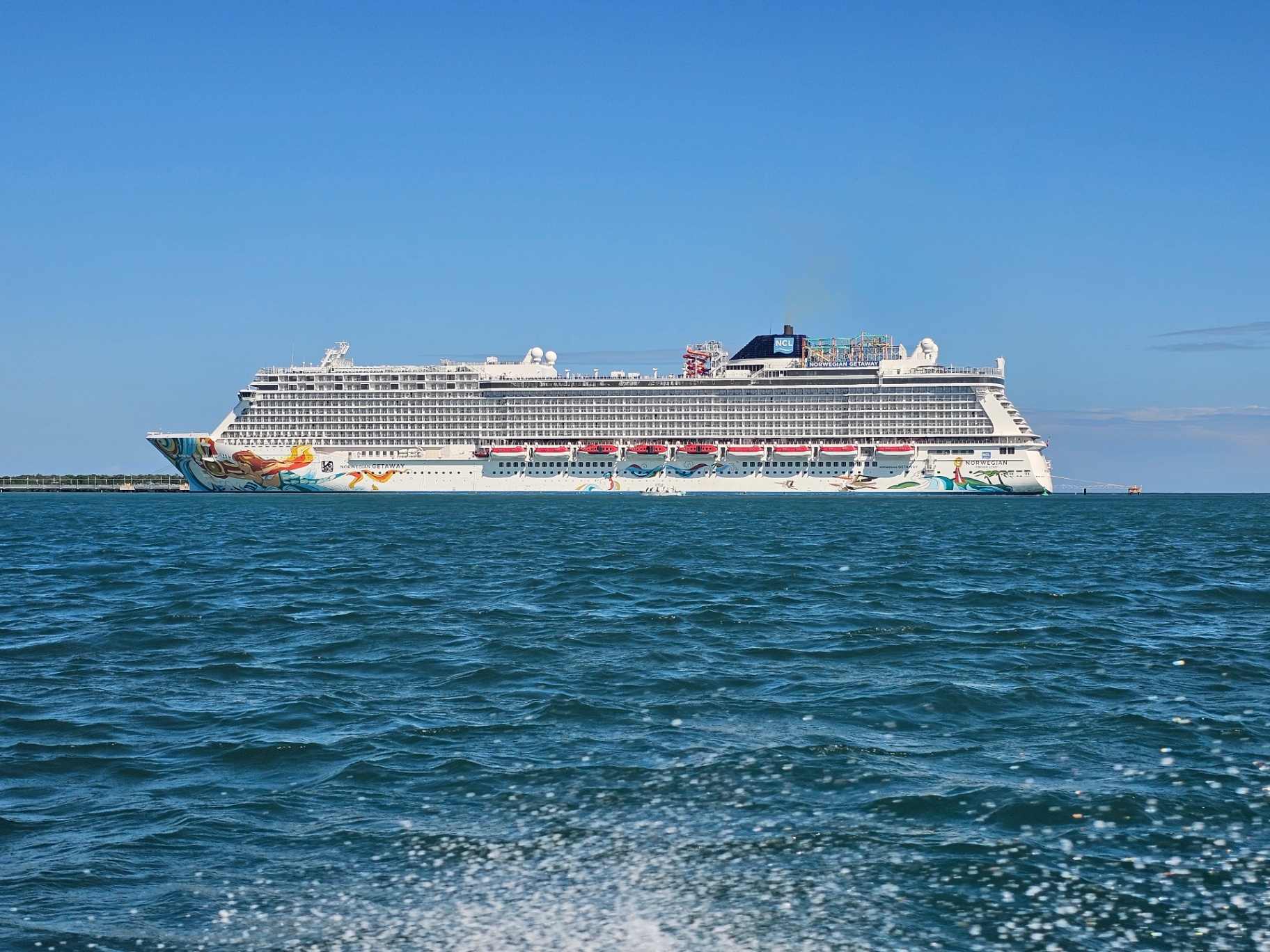 Norwegian Getaway cruise ship anchored offshore