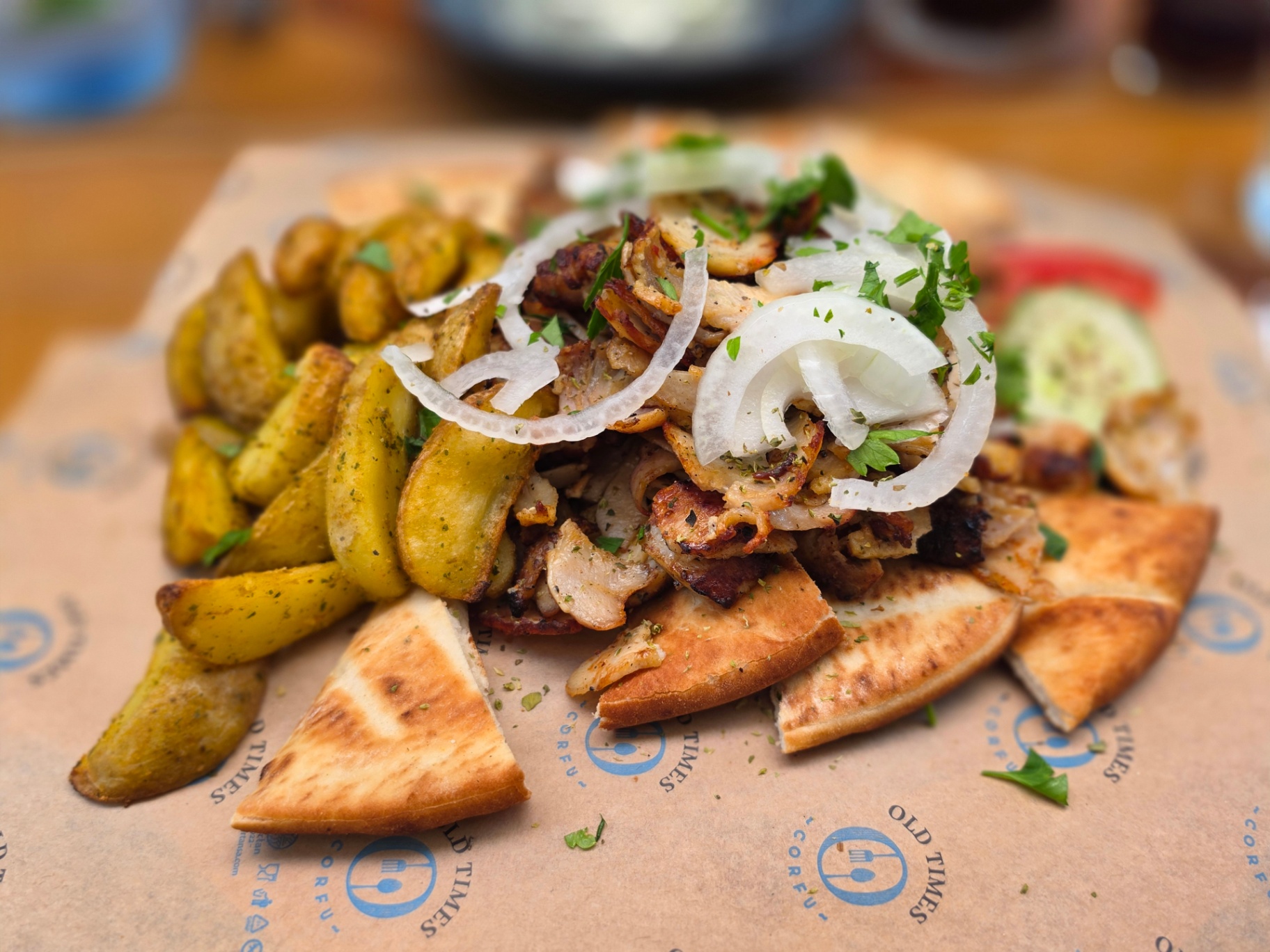 Greek gyros platter with pita and potatoes