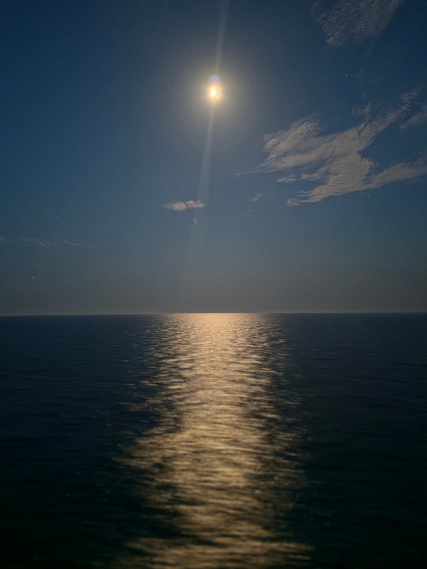 Moonlight reflected on a calm sea at night