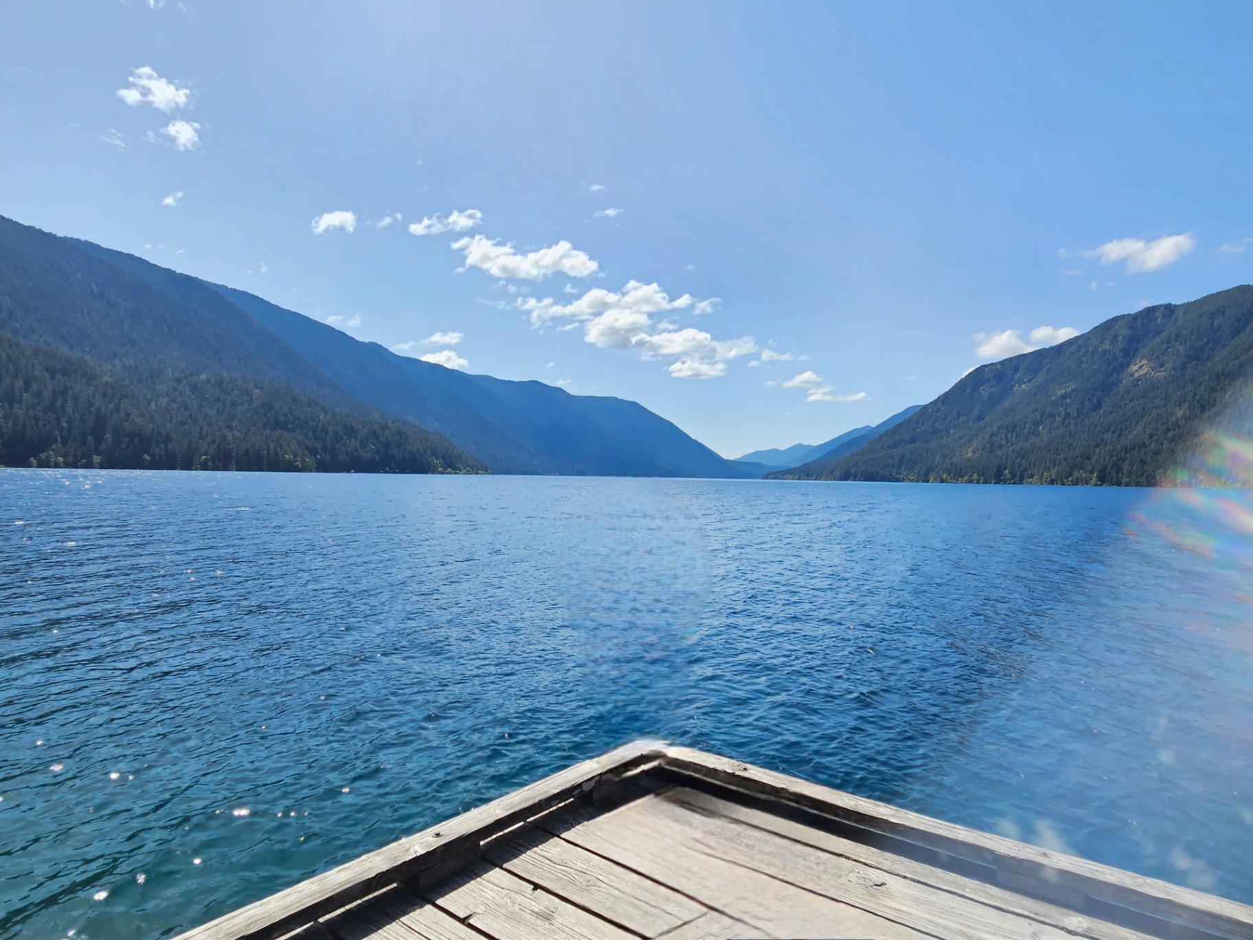 Dock jutting into the blue water of Lake Crescent